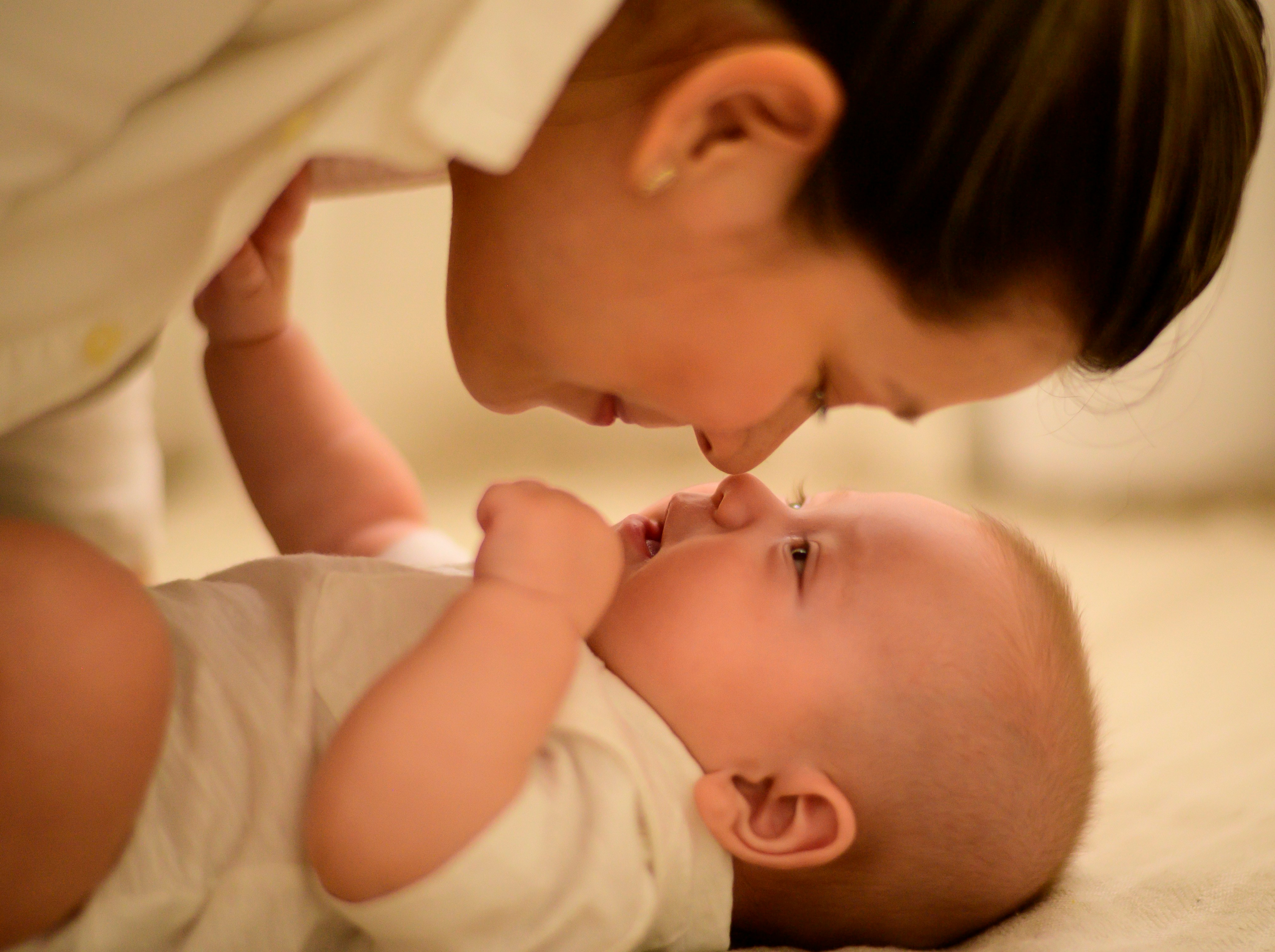 Mother caring for baby with gentle skincare routine